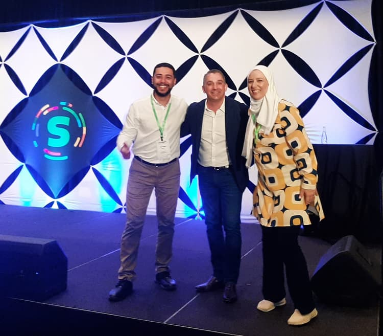 Mohamed Amer and Helaine Mello with Ryan Deiss
